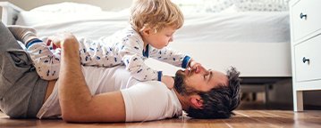 Kid on  Floor with Father